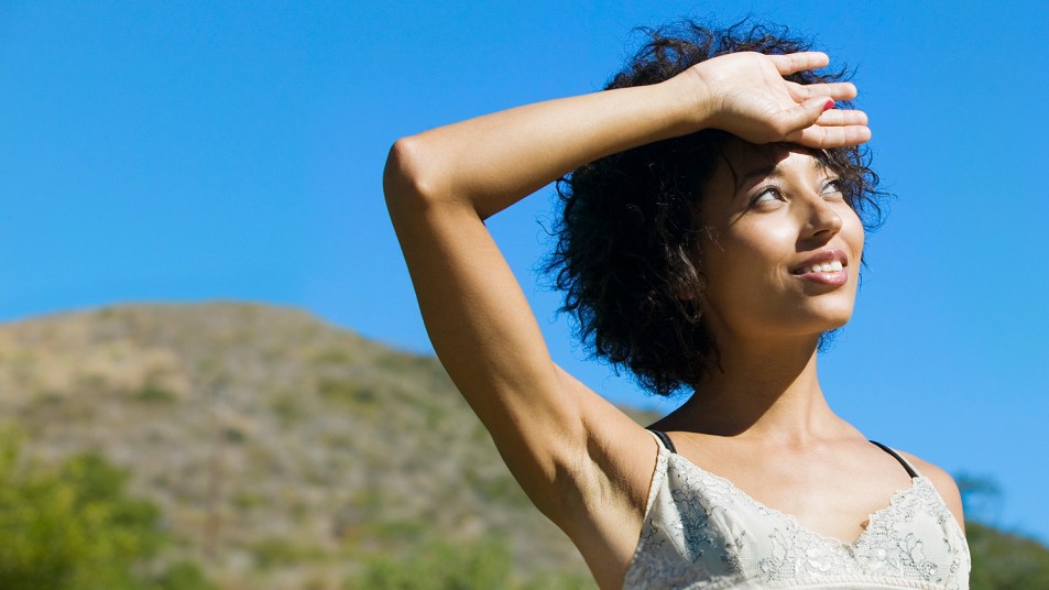 woman standing outside in the hot sun